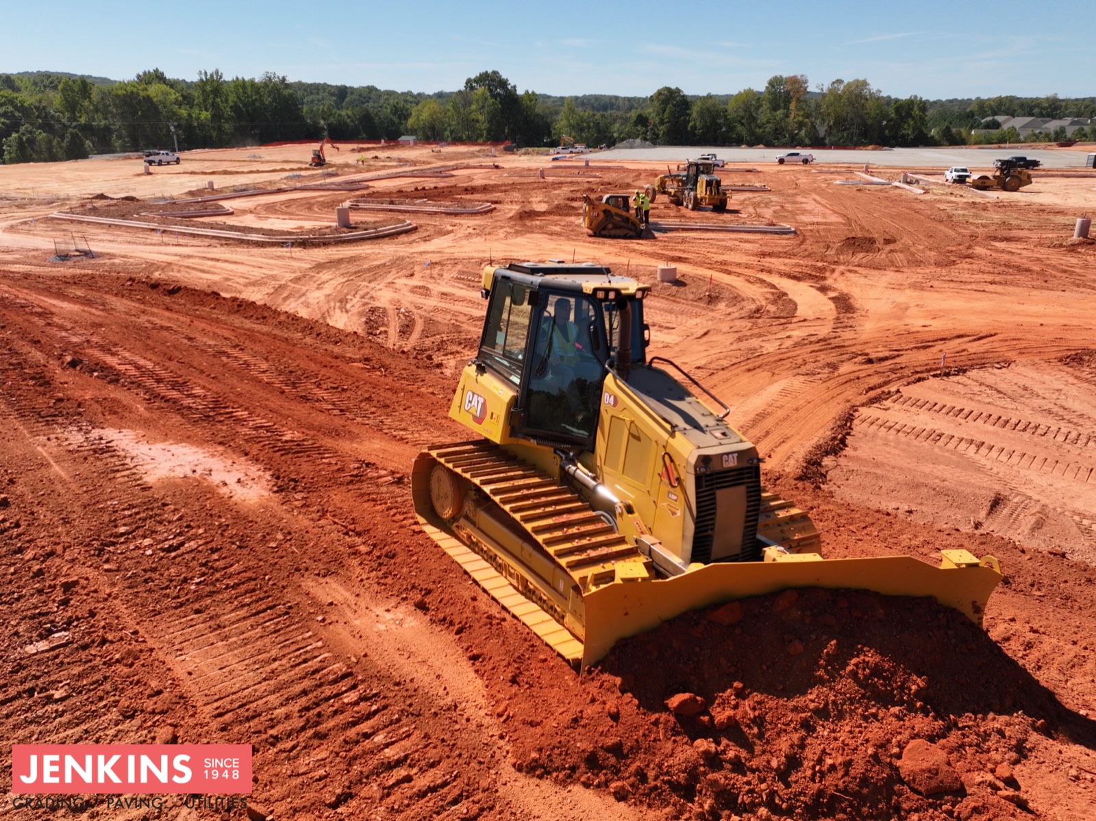 Jenkins Cat D4 dozer shaping a graded site pad