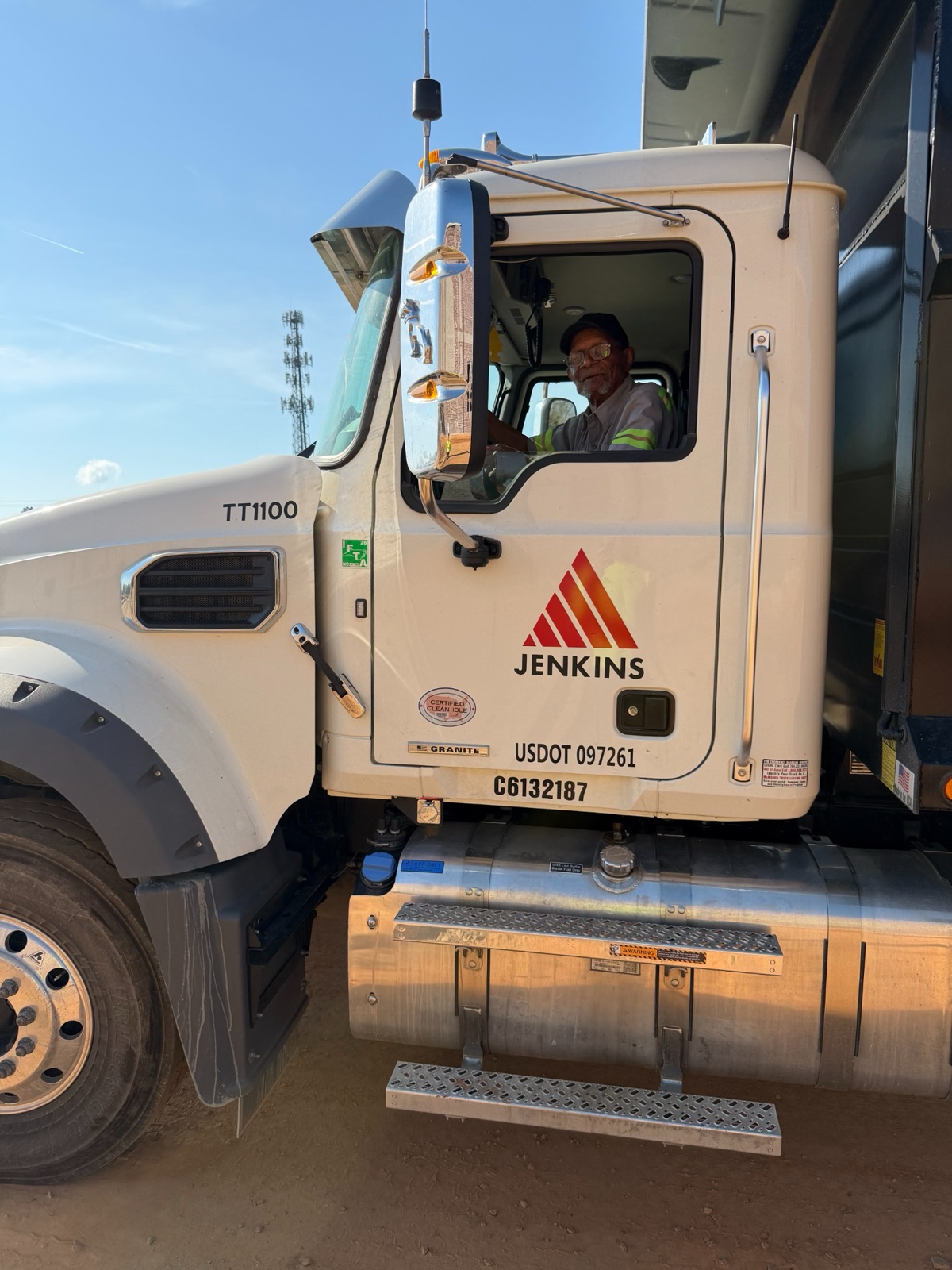 Jenkins truck and driver on a jobsite